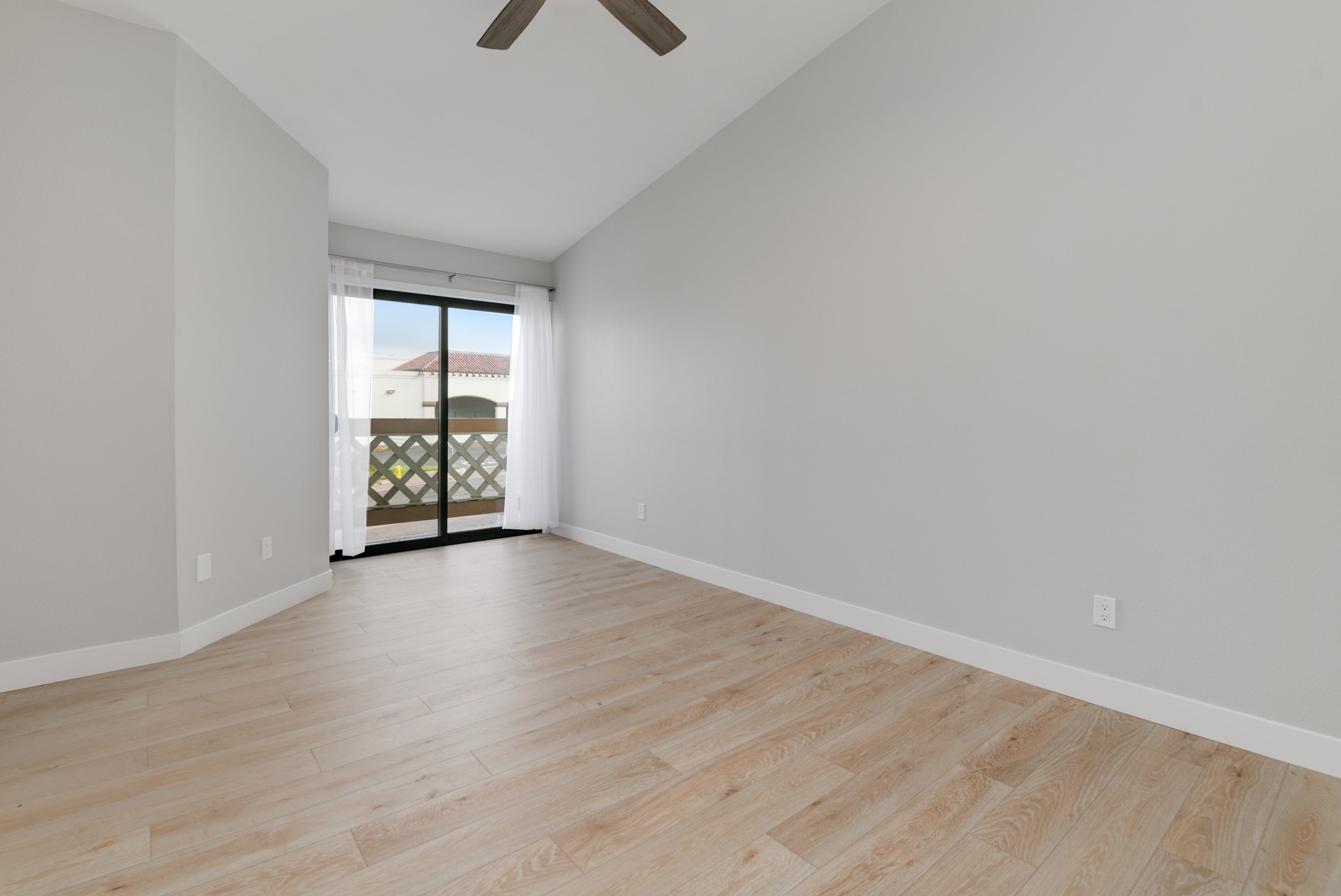 Sandy Wood floors, off white walls, modern patio entrance. Remodeling Source of San Diego, Modern Luxury Home remodels